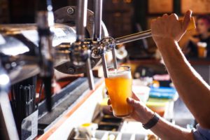 A bartender pouring a beer at a Key West brewery