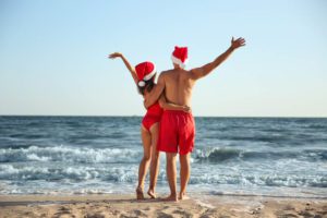 A couple on the beach when spending the holidays in Key West