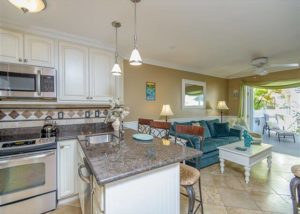 The kitchen and living room of a vacation rental in Key West